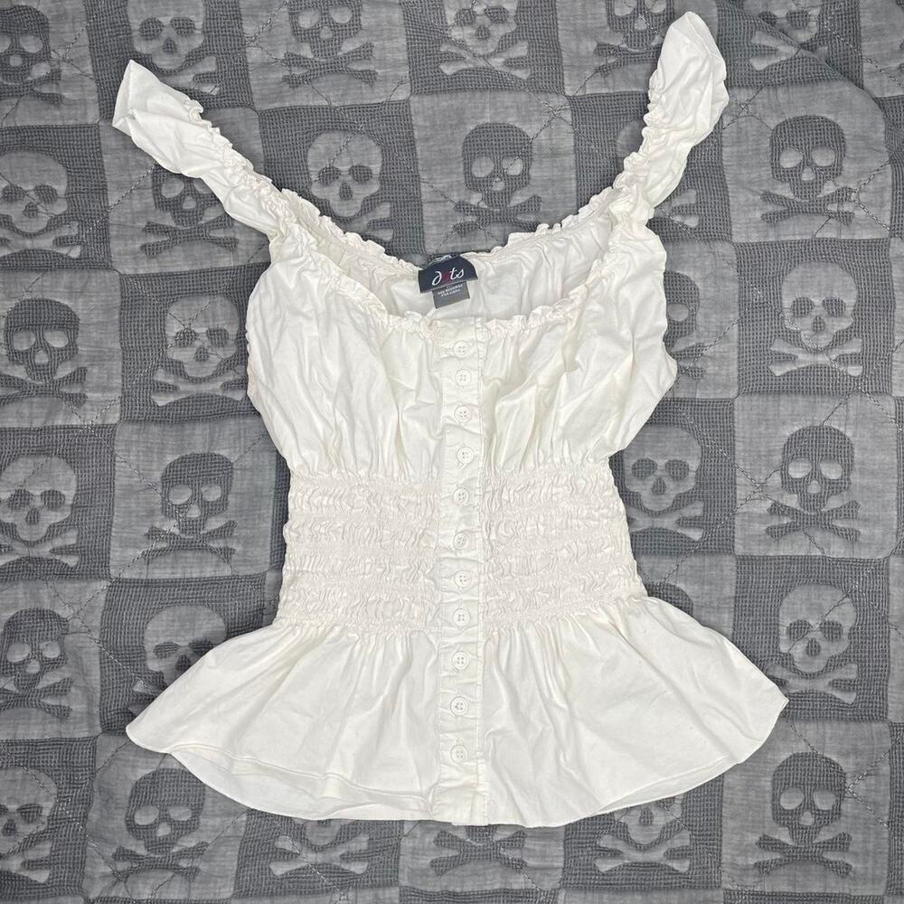 White ruffled top